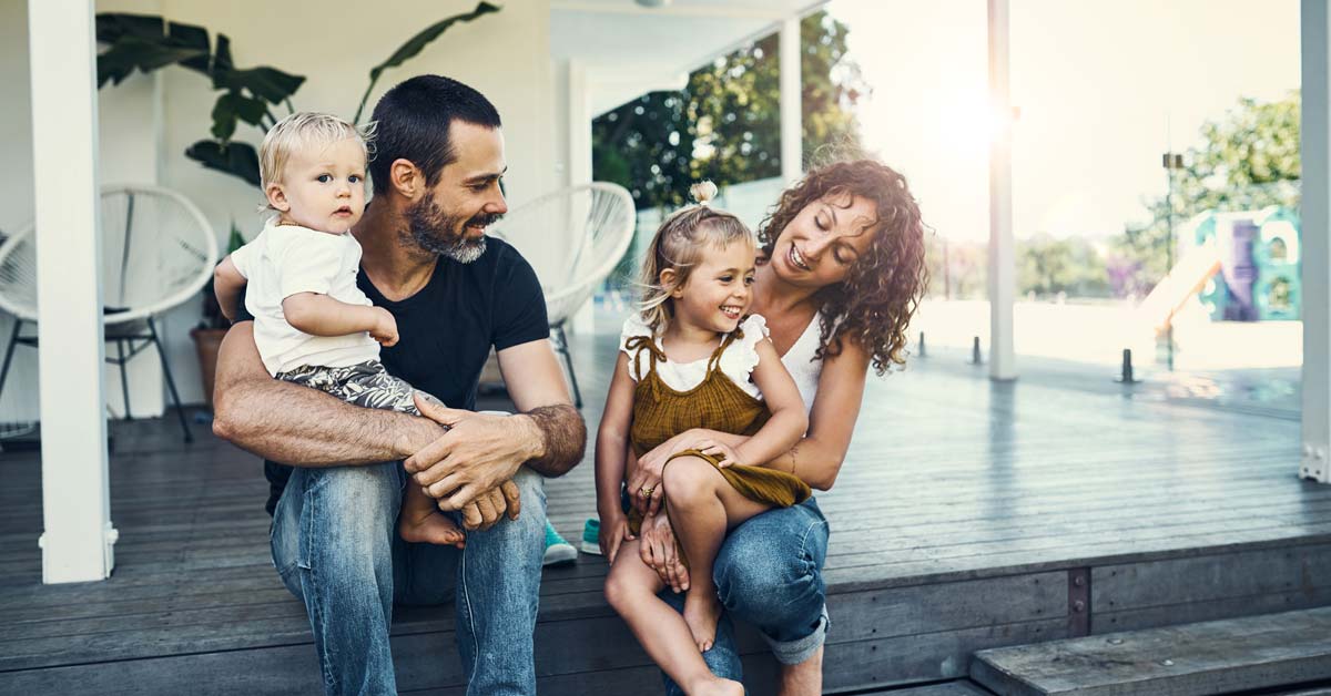 Healthy mom and dad with kids on deck outside. Healthy mom and dad with kids on deck outside.