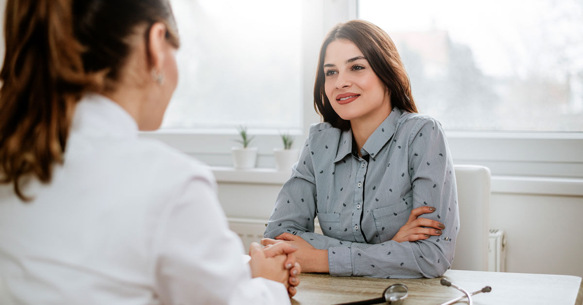 Woman seeing doctor. Woman seeing doctor.