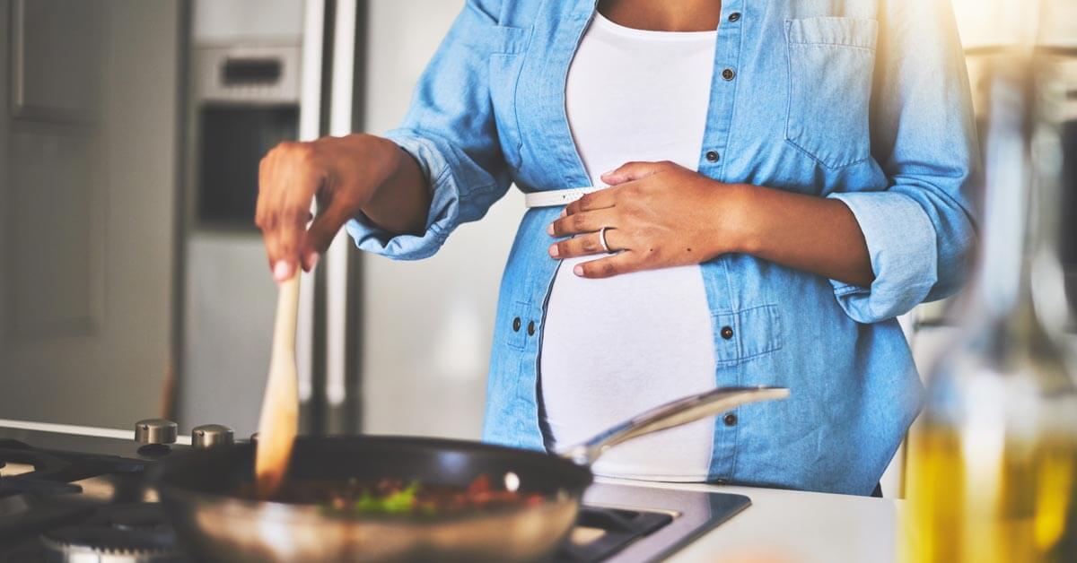 pregnant woman cooking pregnant woman cooking