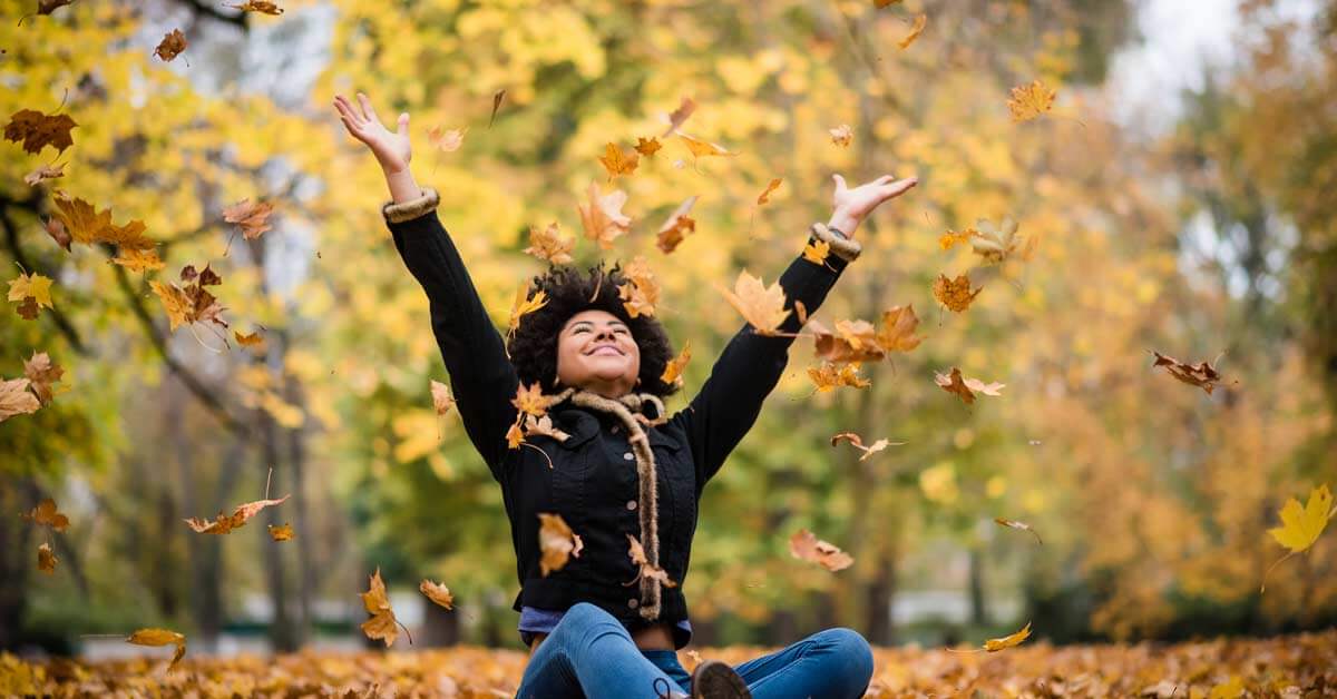 Happy woman outdoors during the fall Happy woman outdoors during the fall