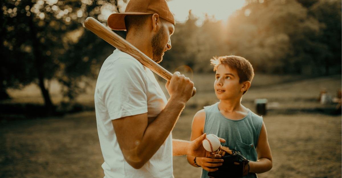 Dad and son practicing baseball. Dad and son practicing baseball.